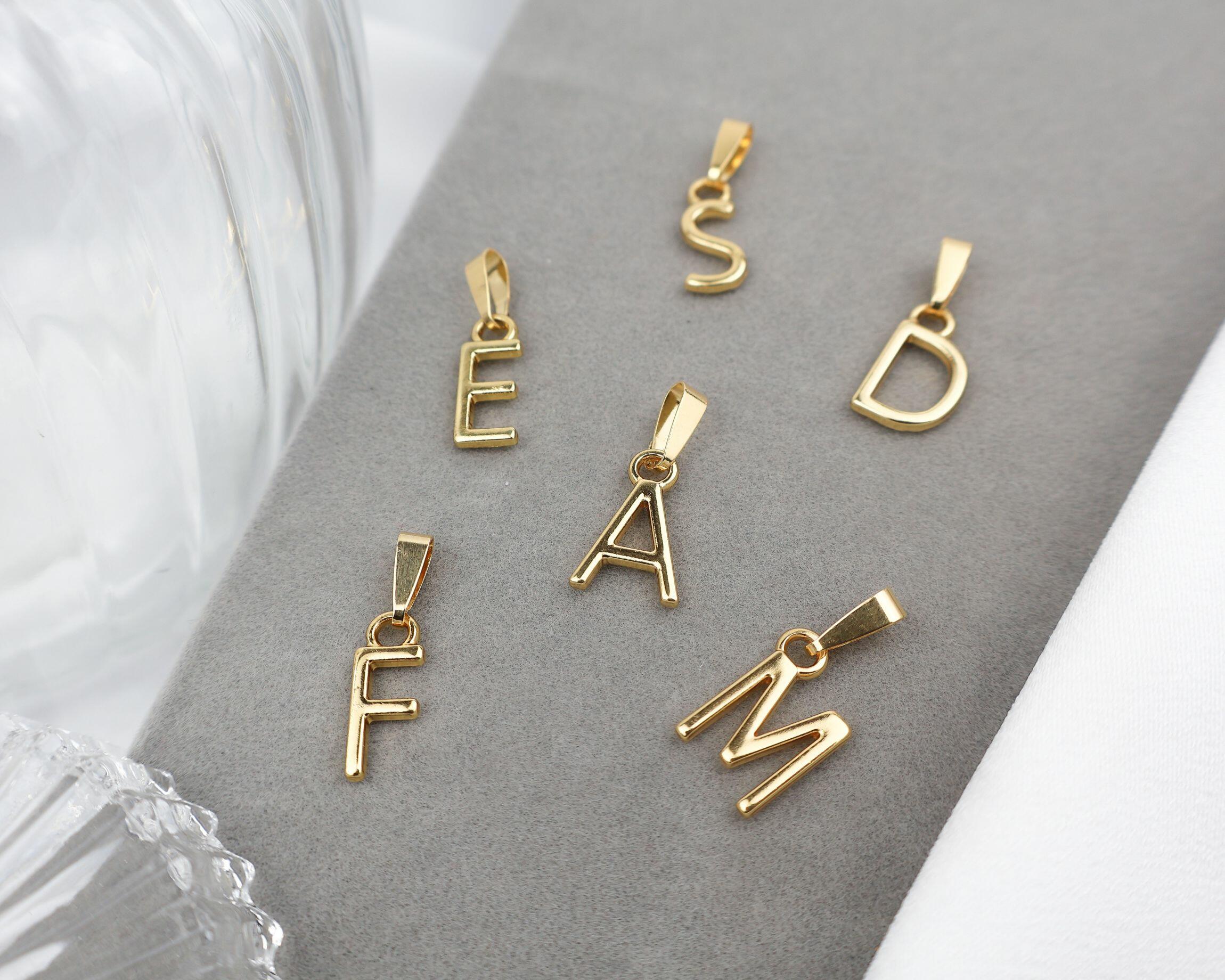 Comprar Pingente Letra Pendurável - Dourado - a partir de R$7,50